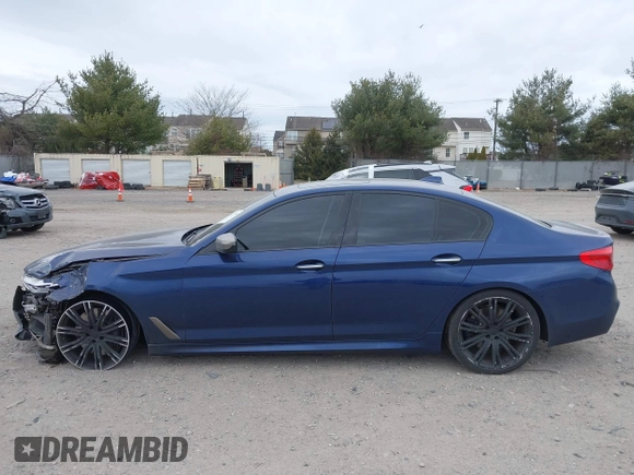 2018 BMW 5 Series M550i xDrive with VIN WBAJB9C56JG463891, listed as a IAAI auction lot 41731556 with 104,860 mi miles. Bid and sale history available at carsss.com. Image 14.