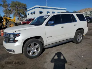 2020 Chevrolet Tahoe Premier with VIN 1GNSKCKC4LR124419, listed as a Copart auction lot 76995734 with 113,872 mi miles and Salvage title. Bid and sale history available at DreamBid. Image 1.