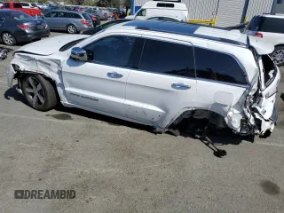 2015 Jeep Grand Cherokee High Altitude с VIN 1C4RJFCM2FC215232, выставлен на аукционе Copart как лот 60002875 с пробегом 122 813 миль миль и Списание • Salvage title. История ставок и продаж доступна на DreamBid. Изображение 2.