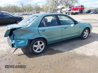 2002 Mazda Protege DX z VIN JM1BJ225721591435, wystawiony jako IAAI lot #42117544 z przebiegiem 191 185 mil mil oraz . Historia ofert i sprzedaży dostępna na DreamBid. Obrazek 4.