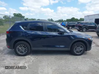 2017 Mazda CX-5 Touring with VIN JM3KFACL0H0227615, listed as a IAAI auction lot 42063618 with 72,291 mi miles. Bid and sale history available at carsss.com. Image 13.