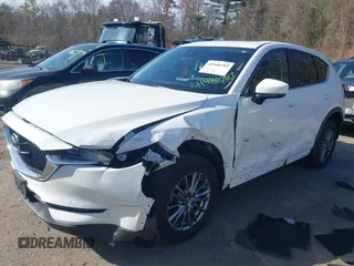 2017 Mazda CX-5 Touring z VIN JM3KFBCL8H0214052, wystawiony jako IAAI lot #41940783 z przebiegiem 120 083 mil mil oraz . Historia ofert i sprzedaży dostępna na DreamBid. Obrazek 2.