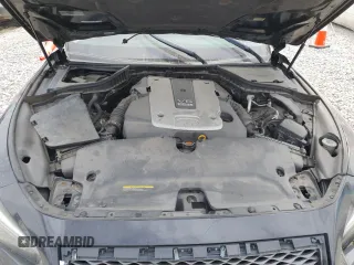 2015 Infiniti Q50 Premium z VIN JN1BV7AR8FM422960, wystawiony jako Copart lot #56393115 z przebiegiem 177 379 mil mil oraz Szkody całkowita. Historia ofert i sprzedaży dostępna na DreamBid. Obrazek 11.