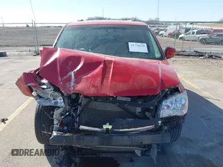 2014 Dodge Grand Caravan SXT with VIN 2C4RDGCG6ER477008, listed as a IAAI auction lot 41770610 with 89,843 mi miles and . Bid and sale history available at DreamBid. Image 13.