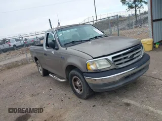 2002 Ford F-150 XL with VIN 3FTRF17212MA23970, listed as a IAAI auction lot 40991449 with 216,487 mi miles. Bid and sale history available at carsss.com. Image 1.