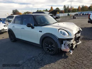 2015 MINI Cooper Hardtop 4 Door with VIN WMWXS5C59FT830039, listed as a Copart auction lot 77198974 with 43,277 mi miles and Salvage Title. Bid and sale history available at carsss.com. Image 4.