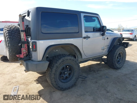 2014 Jeep Wrangler Sport with VIN 1C4AJWAG5EL206565, listed as a IAAI auction lot 42015000 with 90,129 mi miles and . Bid and sale history available at carsss.com. Image 4.