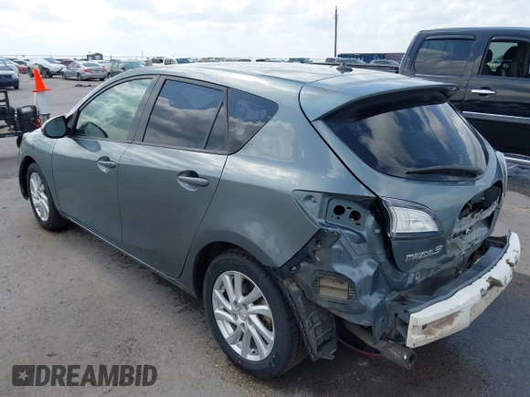 2012 Mazda Mazda3 i Touring with VIN JM1BL1L73C1562553, listed as a IAAI auction lot 42073390 with 227,269 mi miles. Bid and sale history available at carsss.com. Image 3.