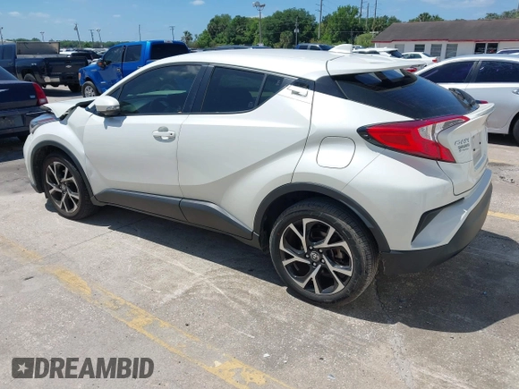 2021 Toyota C-HR LE with VIN JTNKHMBX8M1104427, listed as a IAAI auction lot 41948234 with 24,415 mi miles. Bid and sale history available at carsss.com. Image 3.
