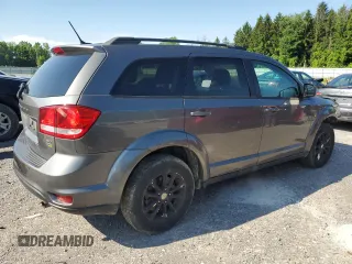 2013 Dodge Journey SXT with VIN 3C4PDCBGXDT630423, listed as a Copart auction lot 62359685 with 151,653 mi miles and Salvage title. Bid and sale history available at DreamBid. Image 3.