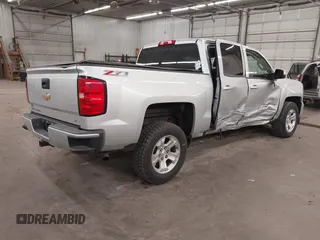 2017 Chevrolet Silverado 1500 LT with VIN 3GCUKREC5HG318772, listed as a IAAI auction lot 42056116 with 82,987 mi miles and . Bid and sale history available at DreamBid. Image 4.
