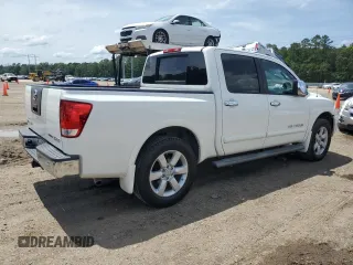 2010 Nissan Titan SE with VIN 1N6BA0ED1AN323167, listed as a Copart auction lot 60237535 with 135,182 mi miles and Salvage title. Bid and sale history available at DreamBid. Image 3.