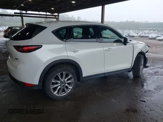 2019 Mazda CX-5 Grand Touring with VIN JM3KFBDMXK0648813, listed as a IAAI auction lot 42524680 with 23,521 mi miles and . Bid and sale history available at DreamBid. Image 4.