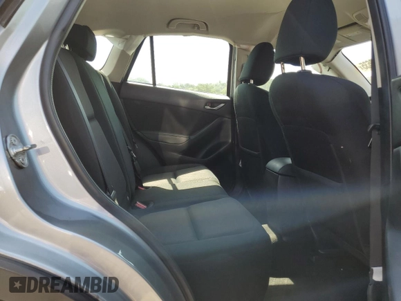2014 Mazda CX-5 Sport with VIN JM3KE2BE7E0334880, listed as a Copart auction lot 61780635 with 96,926 mi miles and Salvage title. Bid and sale history available at DreamBid. Image 11.