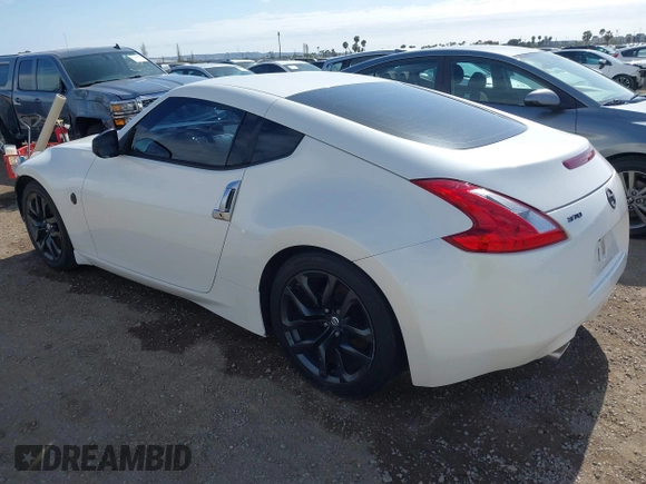 2016 Nissan 370Z Sport z VIN JN1AZ4EH9GM931683, wystawiony jako IAAI lot #42000779 z przebiegiem 113 919 mil mil oraz . Historia ofert i sprzedaży dostępna na DreamBid. Obrazek 3.