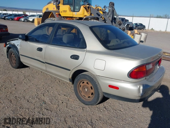 1997 Mazda Protege DX with VIN JM1BC1412V0155780, listed as a IAAI auction lot 42134286 with Not Provided miles and . Bid and sale history available at DreamBid. Image 3.