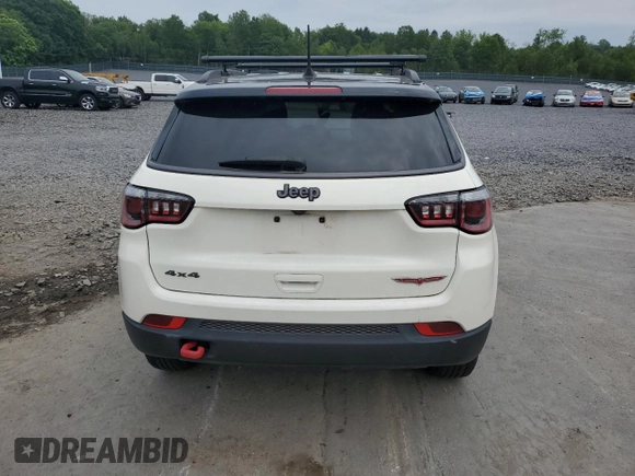 2019 Jeep Compass Trailhawk with VIN 3C4NJDDB5KT671613, listed as a Copart auction lot 61023125 with 64,793 mi miles and Salvage title. Bid and sale history available at DreamBid. Image 6.