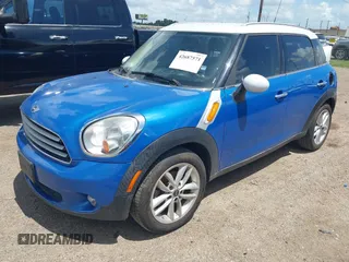 2014 MINI Countryman with VIN WMWZB3C52EWR40215, listed as a IAAI auction lot 42687571 with 106,338 mi miles and . Bid and sale history available at DreamBid. Image 2.