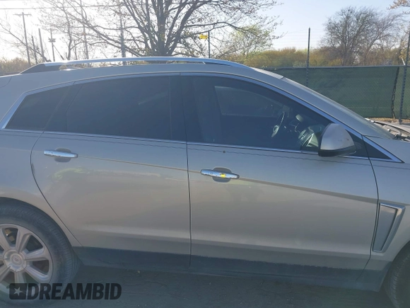 2014 Cadillac SRX Premium Collection with VIN 3GYFNDE37ES574109, listed as a IAAI auction lot 41770404 with 66,478 mi miles and . Bid and sale history available at DreamBid. Image 13.