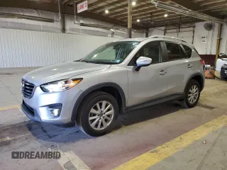 2016 Mazda CX-5 Touring z VIN JM3KE4CY4G0761540, wystawiony jako Copart lot #57335385 z przebiegiem 147 452 mil mil oraz Szkoda całkowita • Salvage title. Historia ofert i sprzedaży dostępna na DreamBid. Obrazek 1.