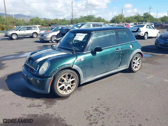 2006 MINI Cooper Hardtop S with VIN WMWRE33566TJ34081, listed as a IAAI auction lot 41265659 with 71,441 mi miles. Bid and sale history available at carsss.com. Image 2.