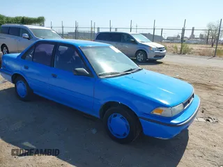 1991 Toyota Corolla z VIN 1NXAE94A1MZ234476, wystawiony jako IAAI lot #42463601 z przebiegiem 216 153 mil mil oraz . Historia ofert i sprzedaży dostępna na DreamBid. Obrazek 1.