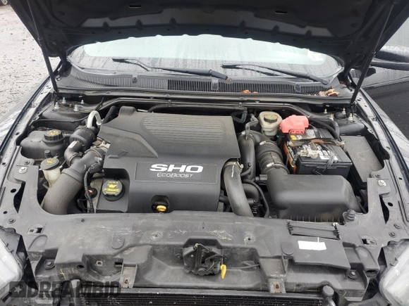 2013 Ford Taurus SHO z VIN 1FAHP2KTXDG168636, wystawiony jako Copart lot #56921795 z przebiegiem 121 103 mil mil oraz Szkoda całkowita • Salvage title. Historia ofert i sprzedaży dostępna na DreamBid. Obrazek 11.