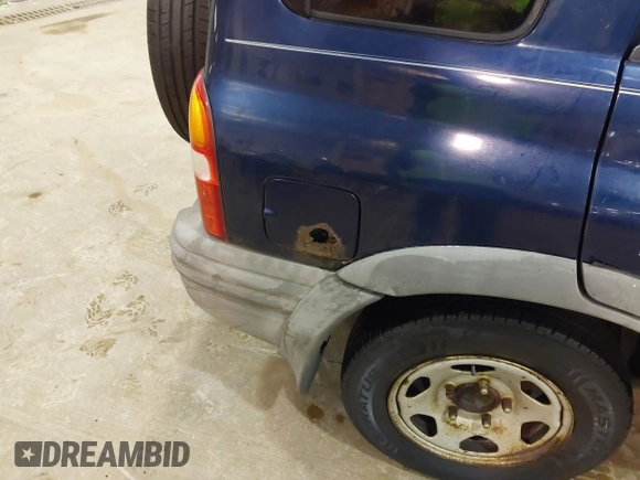 2003 Chevrolet Tracker ZR2 z VIN 2CNBJ734736905310, wystawiony jako IAAI lot #41519431 z przebiegiem 177 643 mil mil oraz . Historia ofert i sprzedaży dostępna na DreamBid. Obrazek 6.