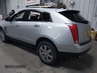 2014 Cadillac SRX Luxury Collection z VIN 3GYFNEE36ES679505, wystawiony jako IAAI lot #41817608 z przebiegiem 62 351 mil mil oraz . Historia ofert i sprzedaży dostępna na DreamBid. Obrazek 3.