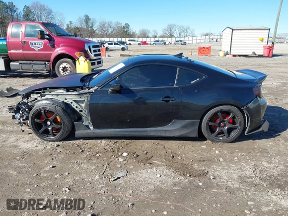 2014 Scion FR-S z VIN JF1ZNAA14E9708590, wystawiony jako IAAI lot #41278089 z przebiegiem 117 357 mil mil oraz . Historia ofert i sprzedaży dostępna na DreamBid. Obrazek 15.