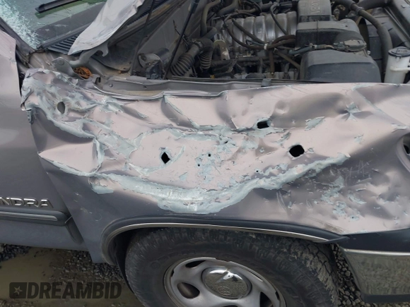 2000 Toyota Tundra SR5 with VIN 5TBRT3414YS086059, listed as a IAAI auction lot 41609962 with 105,030 mi miles and . Bid and sale history available at DreamBid. Image 12.