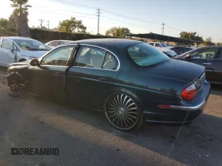 2003 Jaguar S-Type z VIN SAJEA01U73HM48330, wystawiony jako Copart lot #80128574 z przebiegiem Nie podano mil oraz Szkody całkowita. Historia ofert i sprzedaży dostępna na DreamBid. Obrazek 2.