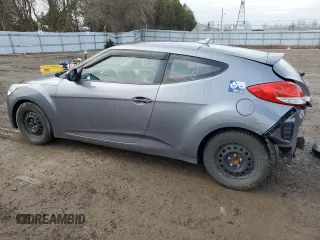 2012 Hyundai Veloster w/Black Int z VIN KMHTC6ADXCU025876, wystawiony jako Copart lot #50377835 z przebiegiem 185 181 mil mil oraz Czysty tytuł • Clean title. Historia ofert i sprzedaży dostępna na DreamBid. Obrazek 2.