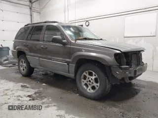 1999 Jeep Grand Cherokee Laredo with VIN 1J4GW58SXXC584734, listed as a IAAI auction lot 41902224 with 209,180 mi miles and . Bid and sale history available at DreamBid. Image 1.
