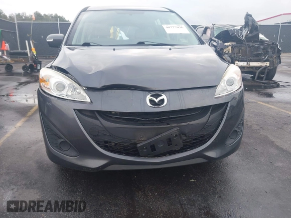 2015 Mazda 5 Sport with VIN JM1CW2BL3F0188052, listed as a IAAI auction lot 40777036 with 69,405 mi miles. Bid and sale history available at carsss.com. Image 6.