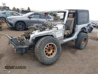 2009 Jeep Wrangler X with VIN 1J4FA24149L775557, listed as a IAAI auction lot 42363653 with Not provided miles and . Bid and sale history available at DreamBid. Image 2.