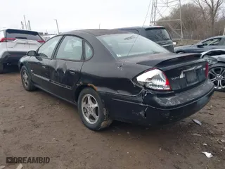 2003 Ford Taurus SEL Deluxe with VIN 1FAHP56S83A243290, listed as a IAAI auction lot 41743609 with 206,399 mi miles. Bid and sale history available at carsss.com. Image 3.