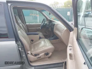 1999 Ford Explorer XLT z VIN 1FMZU35P9XZB75917, wystawiony jako IAAI lot #42132762 z przebiegiem 189 946 mil mil oraz . Historia ofert i sprzedaży dostępna na DreamBid. Obrazek 5.