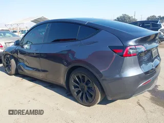 2022 Tesla Model Y Long Range z VIN 7SAYGDEE4NF522698, wystawiony jako IAAI lot #41287885 z przebiegiem 82 306 mil mil oraz . Historia ofert i sprzedaży dostępna na DreamBid. Obrazek 3.