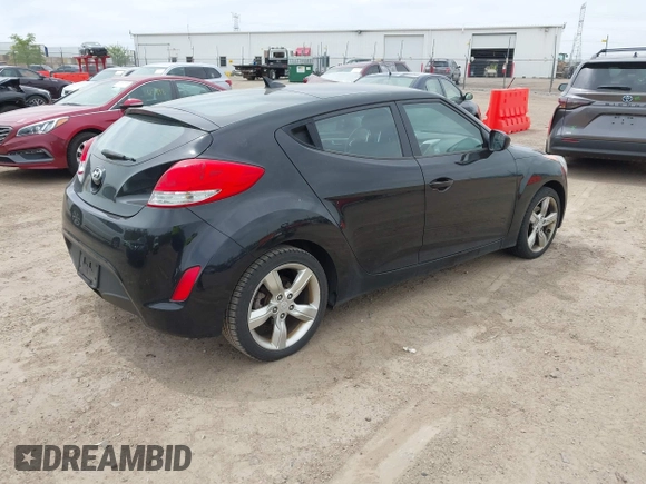 2013 Hyundai Veloster w/Gray Int with VIN KMHTC6AD6DU179826, listed as a IAAI auction lot 42151479 with 82,643 mi miles. Bid and sale history available at carsss.com. Image 4.