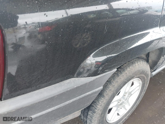 2004 Jeep Grand Cherokee Laredo with VIN 1J4GX48N94C435700, listed as a IAAI auction lot 41809624 with 147,413 mi miles. Bid and sale history available at carsss.com. Image 6.