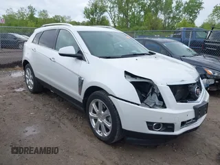 2014 Cadillac SRX Performance Collection z VIN 3GYFNCE34ES519059, wystawiony jako IAAI lot #42237351 z przebiegiem 80 578 mil mil oraz . Historia ofert i sprzedaży dostępna na DreamBid. Obrazek 1.
