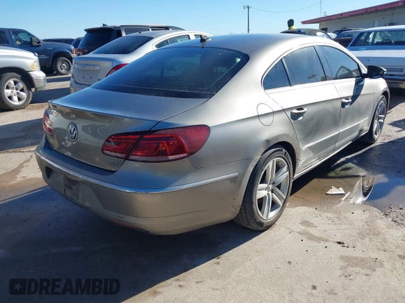2014 Volkswagen CC Sport with VIN WVWBN7AN1EE518559, listed as a IAAI auction lot 41208853 with 154,957 mi miles. Bid and sale history available at carsss.com. Image 4.