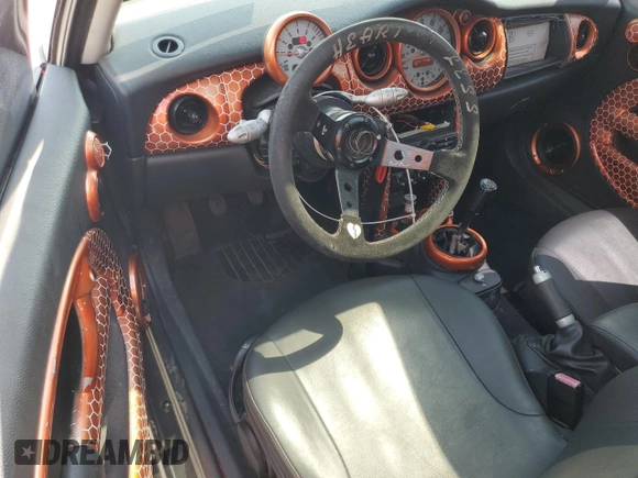 2004 MINI Hardtop with VIN WMWRC33444TC50103, listed as a Copart auction lot 63449615 with 144,467 mi miles and Salvage title. Bid and sale history available at DreamBid. Image 8.
