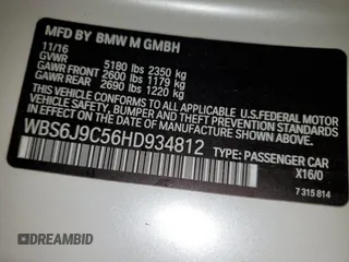 2017 BMW M6 z VIN WBS6J9C56HD934812, wystawiony jako Copart lot #44018915 z przebiegiem 84 409 mil mil oraz Szkoda całkowita • Salvage title. Historia ofert i sprzedaży dostępna na DreamBid. Obrazek 12.