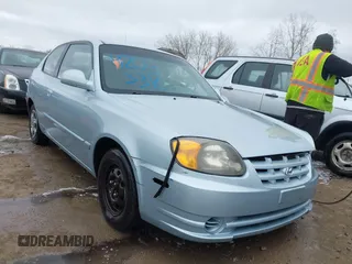 2003 Hyundai Accent GL with VIN KMHCG35C23U264360, listed as a IAAI auction lot 42033316 with 100,991 mi miles. Bid and sale history available at carsss.com. Image 1.