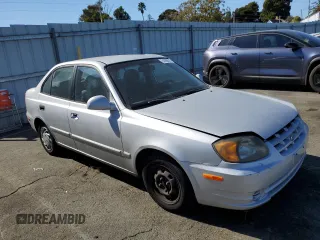 2003 Hyundai Accent GL with VIN KMHCG45CX3U488238, listed as a Copart auction lot 74399014 with 130,915 mi miles and Clean Title. Bid and sale history available at carsss.com. Image 4.