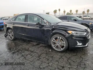 2020 Ford Fusion Titanium with VIN 3FA6P0D94LR153375, listed as a Copart auction lot 59609415 with 104,292 mi miles and Clean title. Bid and sale history available at DreamBid. Image 4.