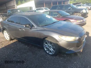 2015 Mazda 6 i Touring with VIN JM1GJ1V57F1196530, listed as a IAAI auction lot 42727182 with 317,751 mi miles and . Bid and sale history available at DreamBid. Image 1.