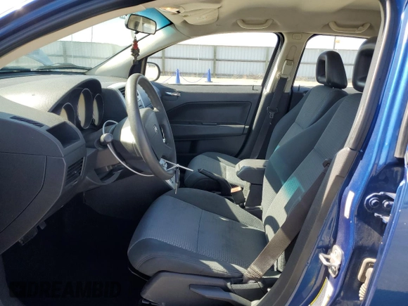 2009 Dodge Caliber SXT with VIN 1B3HB48A99D157051, listed as a Copart auction lot 52098965 with 188,268 mi miles and Salvage Title. Bid and sale history available at carsss.com. Image 7.